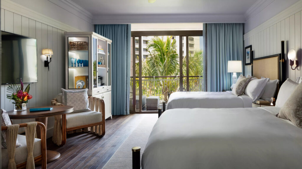 A two queen bedroom with natural colors overlooking Baha Mar resort.